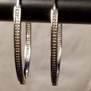 Sterling silver inside/outside diamond earrings.